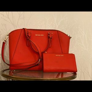 Red/orange Michael Kors handbag and wallet.